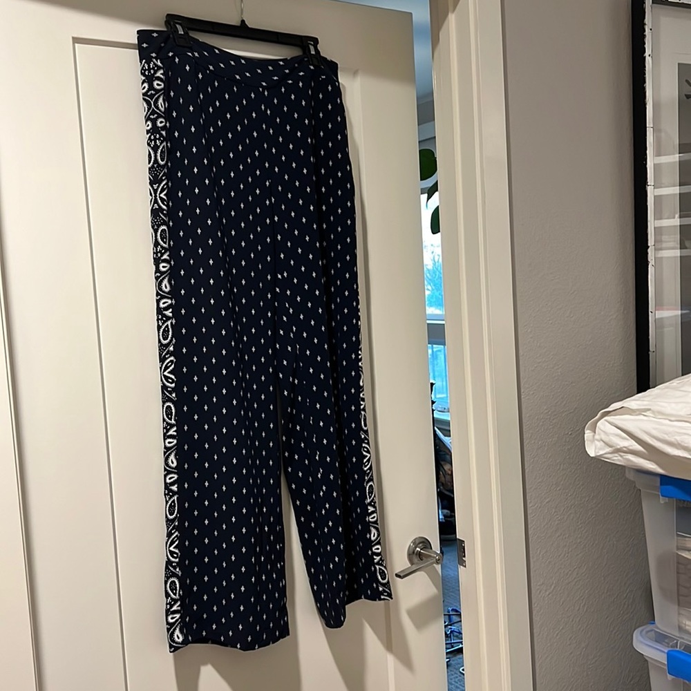 CAbi Size 8 blue and white patterned wide legged, flowing pants.